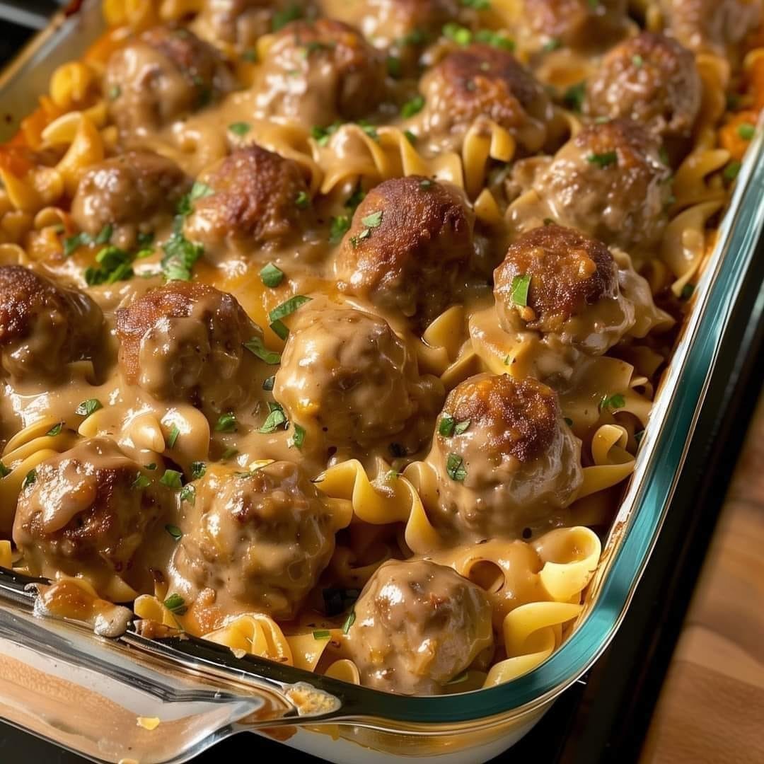 Swedish meatballs presented with egg noodles